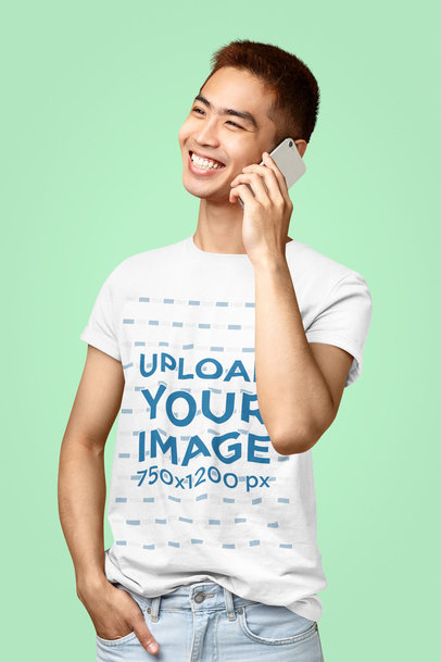Mockup Featuring a Smiling Man with a T-Shirt Talking on the Phone