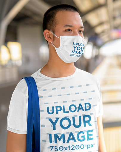 Face Mask Mockup Featuring a Serious Man Wearing a Customizable T-Shirt 