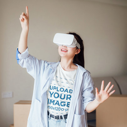 T-Shirt Mockup of a Woman Playing with a VR Headset On