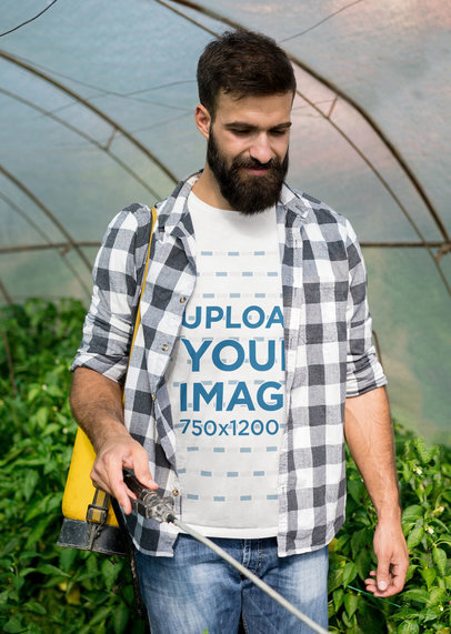 T-Shirt Mockup Featuring a Farmer in a Greenhouse 