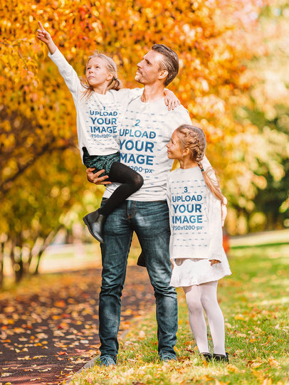 Long-Sleeve Tee Mockup Featuring a Father and His Daughters at a Park 