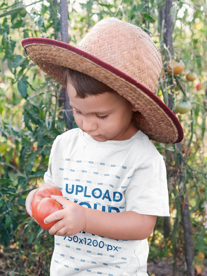 T-Shirt Mockup Featuring a Boy Holding a Tomato 44363-r-el2