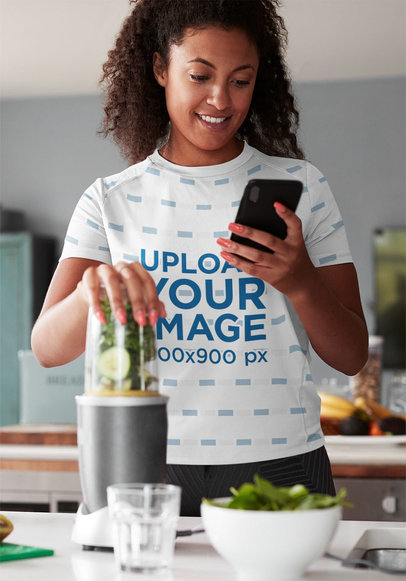 Mockup of a Woman in a Sublimated Tee Making a Healthy Juice 43947-r-el2