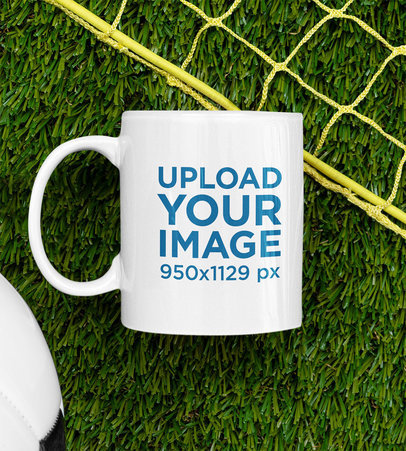 Mockup of an 11 oz Mug Placed by a Soccer Ball and a Net 
