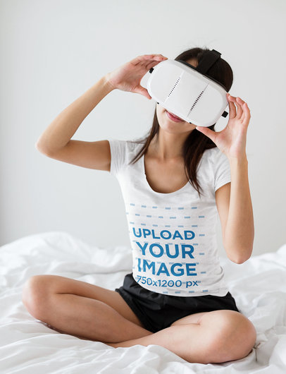 T-Shirt Mockup Featuring a Woman With a VR Headset Sitting on a Bed 44427-r-el2