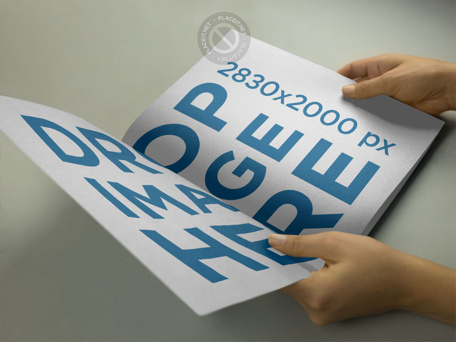 Placeit Mockup of a Catalog Held by a Woman on a Gray Surface While