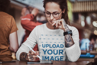 Long Sleeve Tee Mockup of a Concentrated Designer Working