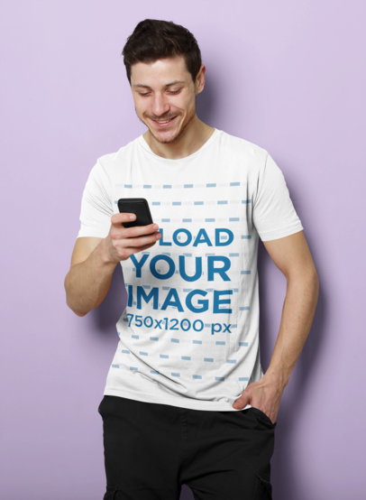 T-Shirt Mockup of a Man Checking His Phone in a Studio 40087-r-el2