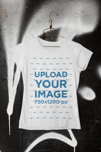 T-Shirt Mockup Featuring a Graffiti Wall as Background