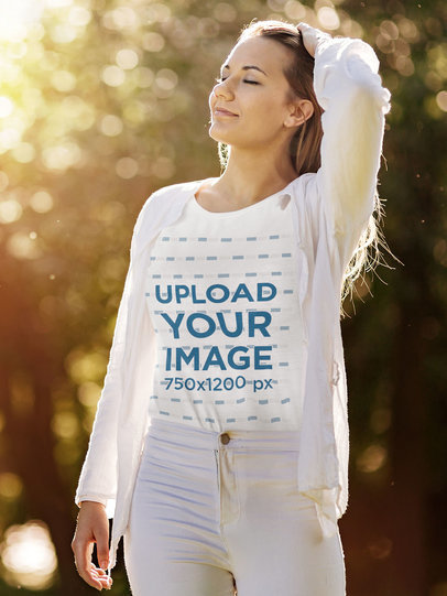 T-Shirt Mockup Featuring a Woman Enjoying an Autumn Day