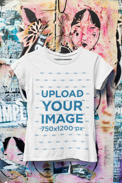 Mockup of a T-Shirt Hanging on a Wall with Urban Art 