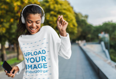Sweatshirt Mockup of a Happy Woman Dancing on the Street