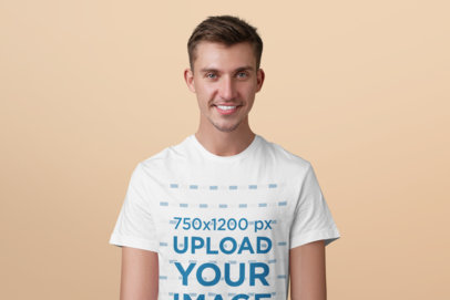 Mockup of a Happy Man Wearing a Basic Tee at a Studio