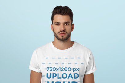 T-Shirt Mockup Featuring a Bearded Man at a Studio 
