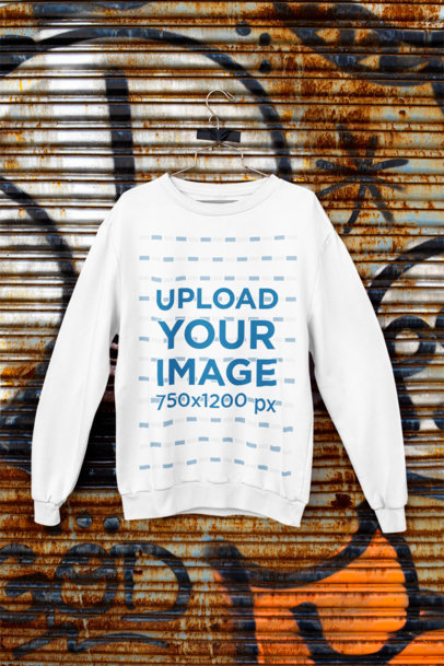 Mockup of a Crewneck Sweatshirt Hanging Against a Rusty Surface m450