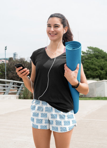 Sublimated Shorts Mockup of a Woman Walking to Pilates Class