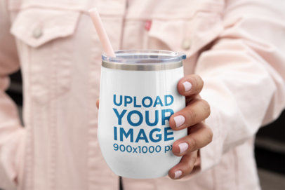Mockup of a Woman Showing Off Her Tumbler
