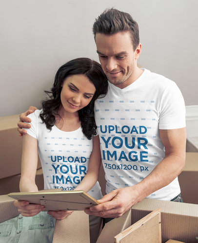 T-Shirt Mockup of a Couple Unboxing Personal Belongings