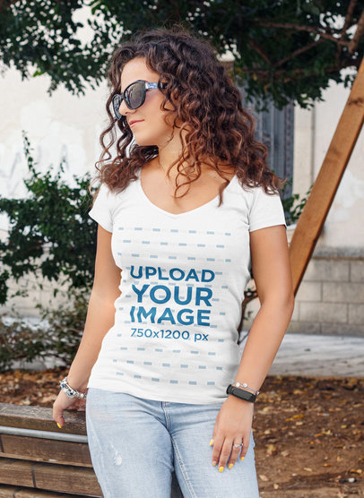 Mockup of a Curly-Haired Woman Wearing a Deep V-Neck T-Shirt