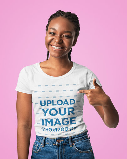 Mockup of a Smiling Woman Pointing at Her Round Neck T-Shirt 