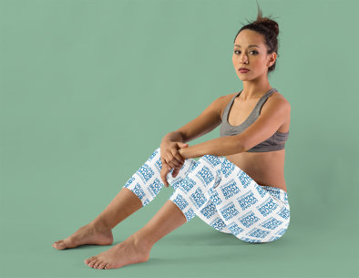 Leggings Mockup Featuring a Serious Woman Sitting in a Studio