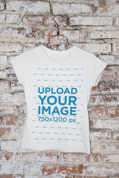 Mockup of a Round Neck Tee Placed on a Hanger by a Brick Wall 
