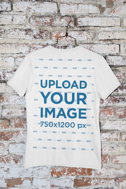 Mockup of a Round Neck T-Shirt Hanged by a Brick Wall 