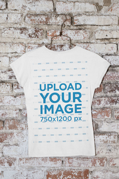 Back-View Mockup of a T-Shirt Hanging Against a Brick Wall m440