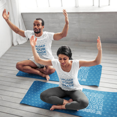 T-Shirt Mockup of a Couple Doing Meditating over Yoga Mats
