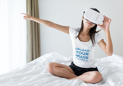 Mockup of a Woman Wearing a T-Shirt and Using a VR Headset in Her Bedroom 44852-r-el2
