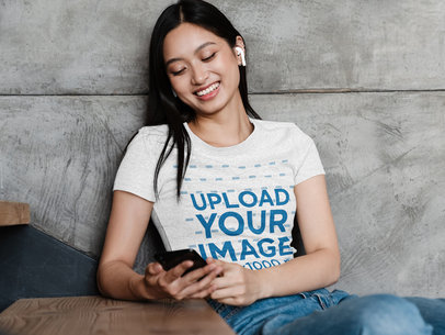 Heather T-Shirt Mockup of a Woman Sitting on the Stairs 