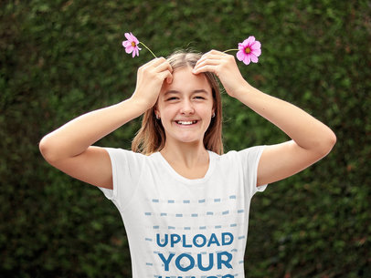 T-Shirt Mockup of a Teenager Posing with Flowers in Her Hair 