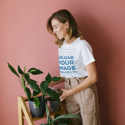 T-Shirt Mockup of a Woman Watering Her Plants 45031-r-el2