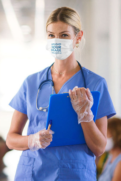 Face Mask Mockup Featuring a Female Doctor Holding a Clipboard 