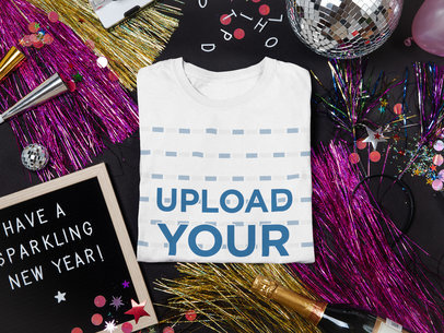 Mockup of a Folded T-Shirt Surrounded by New Year's Party Items