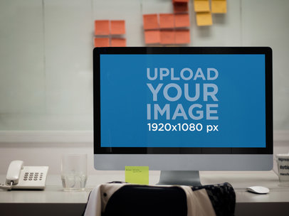 Mockup of an iMac Placed Inside an Office