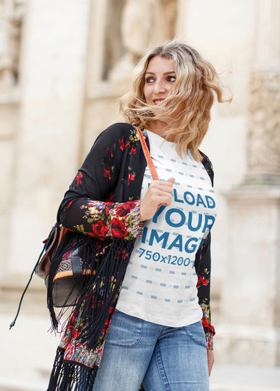 T-Shirt Mockup of a Stylish Woman Walking in a City 