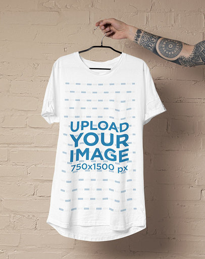 Mockup of a Tattooed Man Holding a Round Neck Tee 