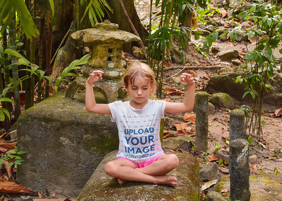 T-Shirt Mockup of a Little Girl Meditating in the Jungle 