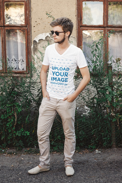 V-Neck T-Shirt Mockup of a Man With Sunglasses Posing by an Old House 43685-r-el2
