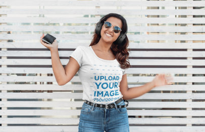 Round Neck Tee Mockup of a Woman Listening Music with Headphones