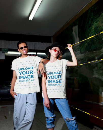 T-Shirt Mockup of a Man and a Woman Posing Featuring an Urban Aesthetic