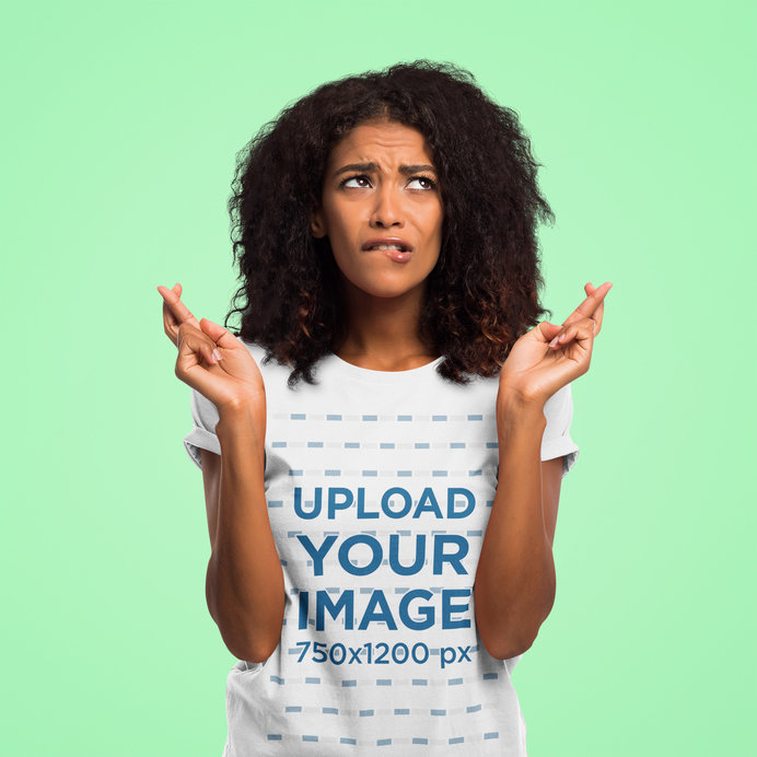 T-Shirt Mockup of a Worried Woman Posing With Her Fingers Crossed 