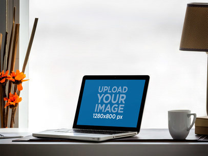 Mockup of a MacBook Pro Placed Inside an Office