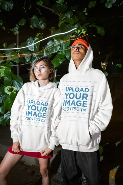 Hoodie Mockup of a Man and a Woman Looking Drowsy at a Party
