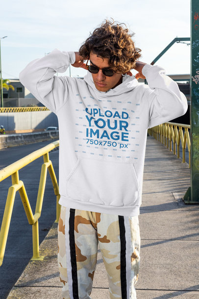 Streetwear-Styled Hoodie Mockup Featuring a Man on the Street