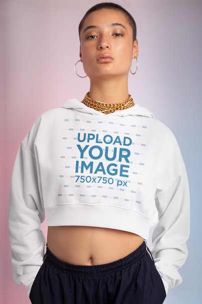 Crop Top Hoodie Mockup of a Defiant Woman in a Studio