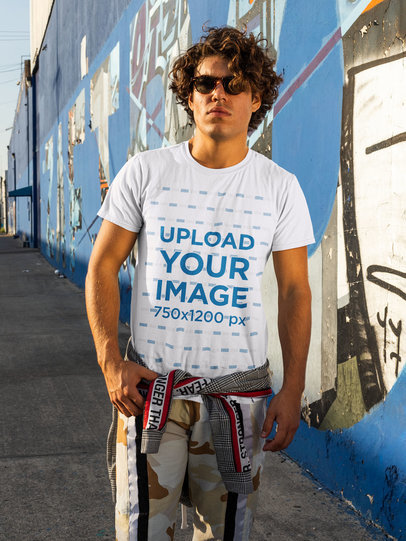 Streetwear-Styled T-Shirt Mockup Featuring a Man in an Urban Setting