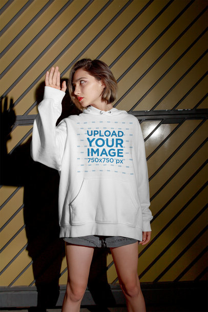 Hoodie Mockup of a Short Haired Woman Looking at Her Shadow
