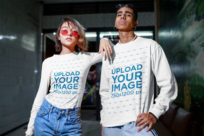 Mockup of a Man Wearing a Sweatshirt and a Woman Wearing a Long Sleeve Tee